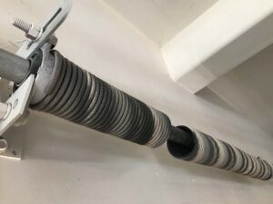 Repair broken garage door torsion springs